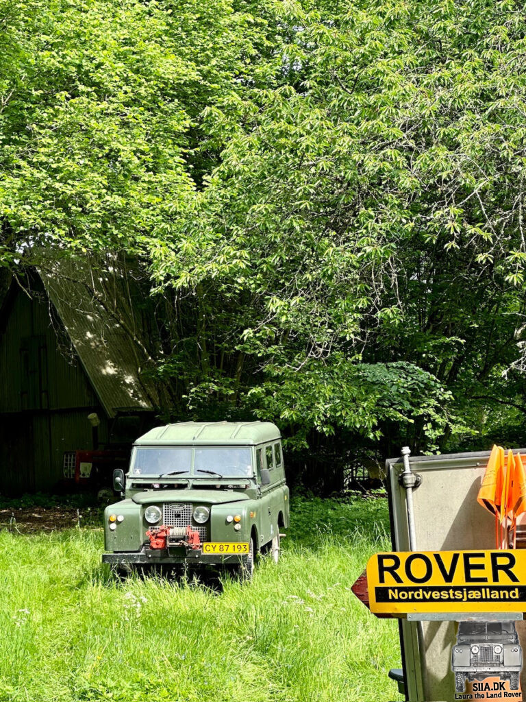 A 1962 Land Rover Series IIa appears from the forrest